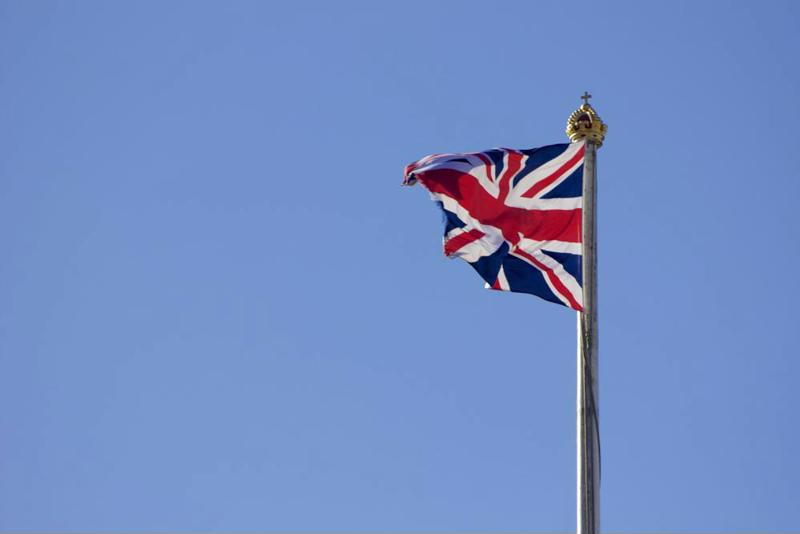 Union Jack flag flying on flagpole is what you'll see after a potential move to the UK.