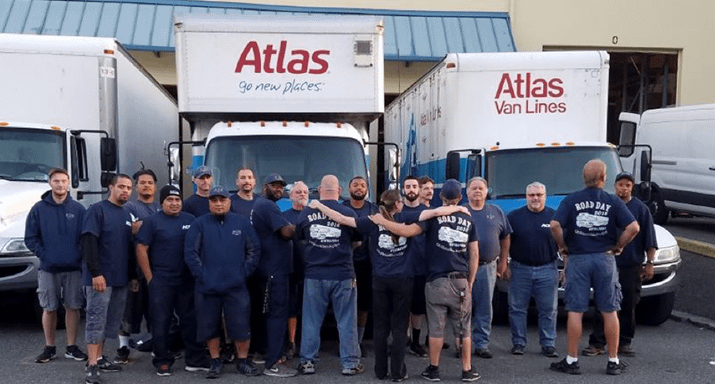 Group of truck drivers in front of Atlas trucks