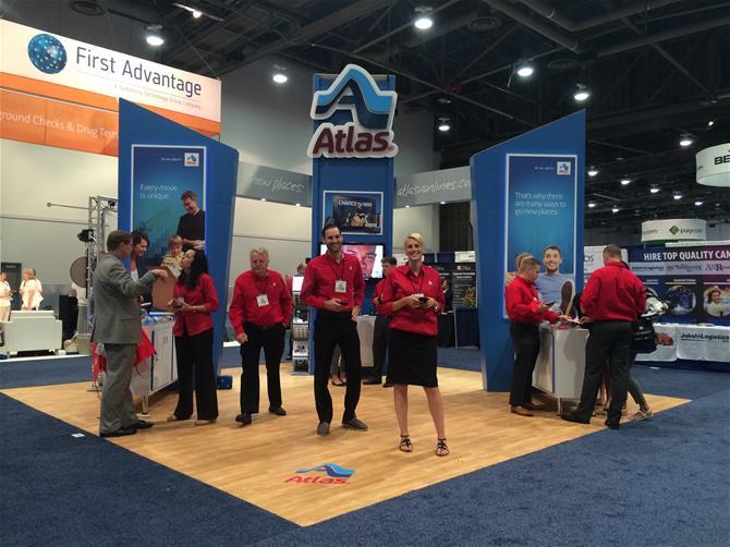 Group of Atlas employees at the Atlas booth at SHRM 2015