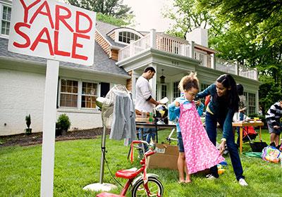 Family shopping at a moving sale they found with yard sale ads