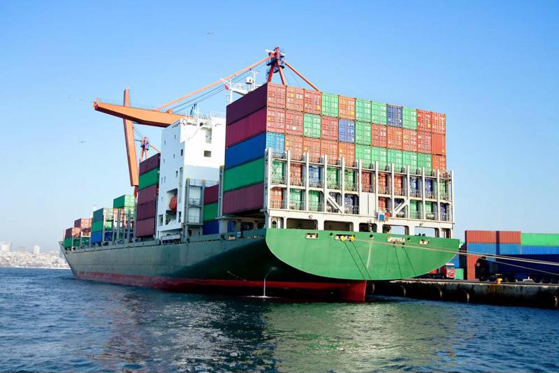 Large cargo ship stacked with containers.