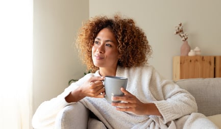 Woman smiling looking out window