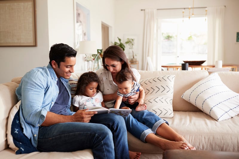 family-on-couch-together-in-their-new-home