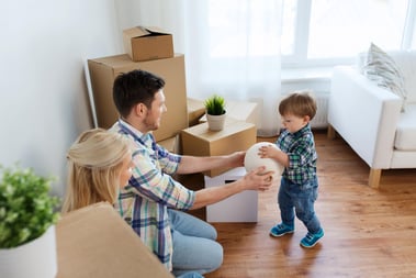 Family in home with boxes