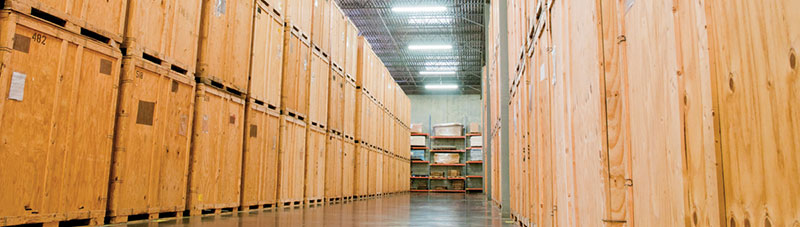 an aisle between storage containers in a storage facility